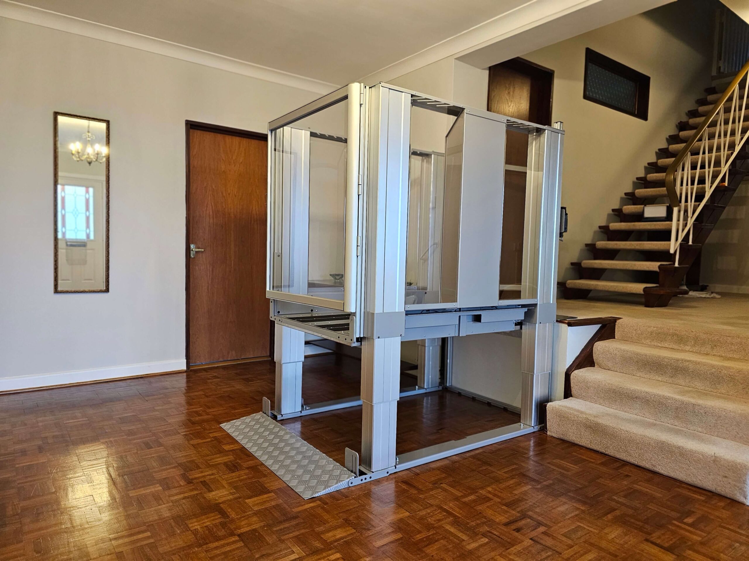 Aluminum silver steplift with glass doors