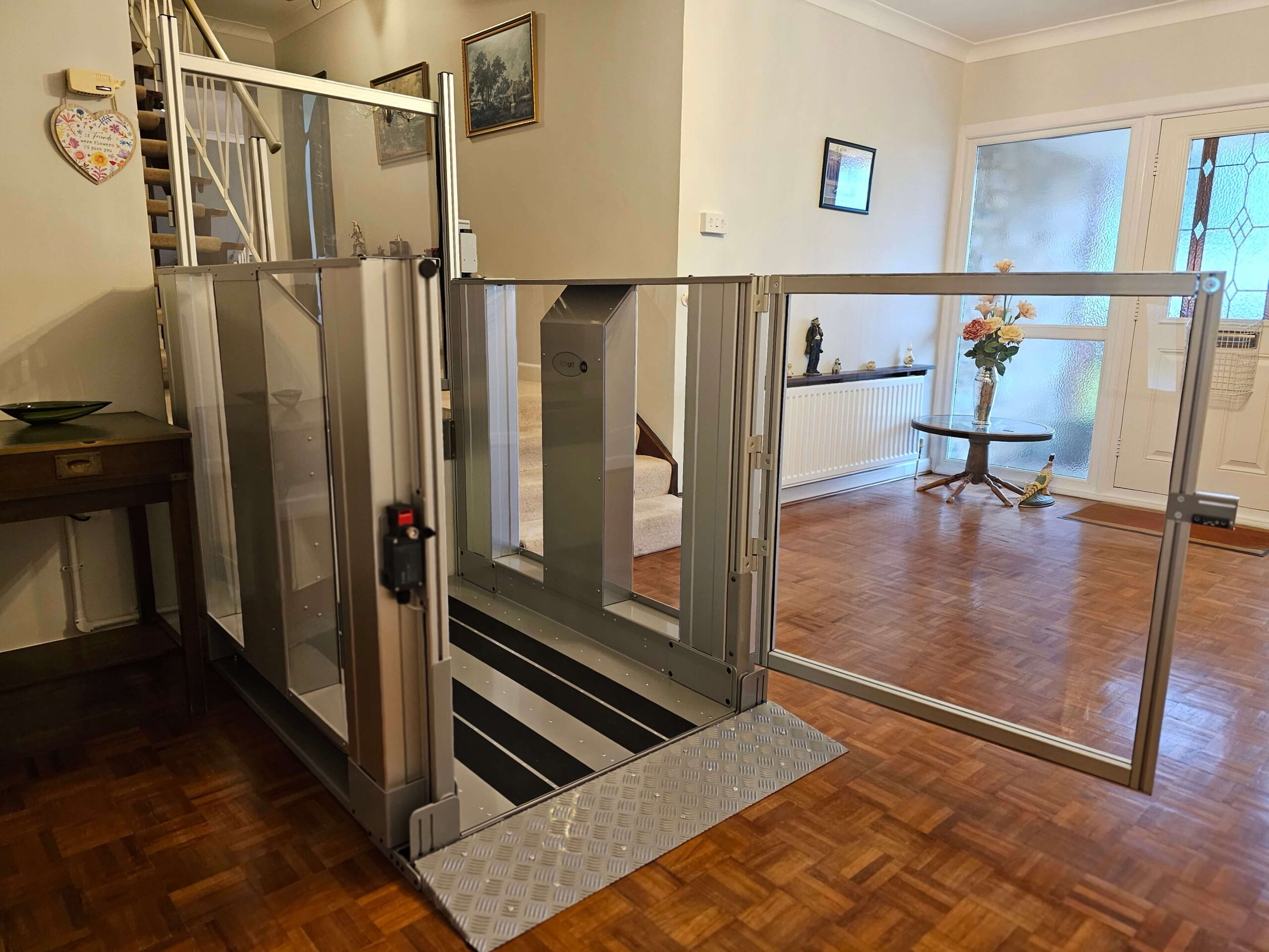 Platform lift with the glass door open