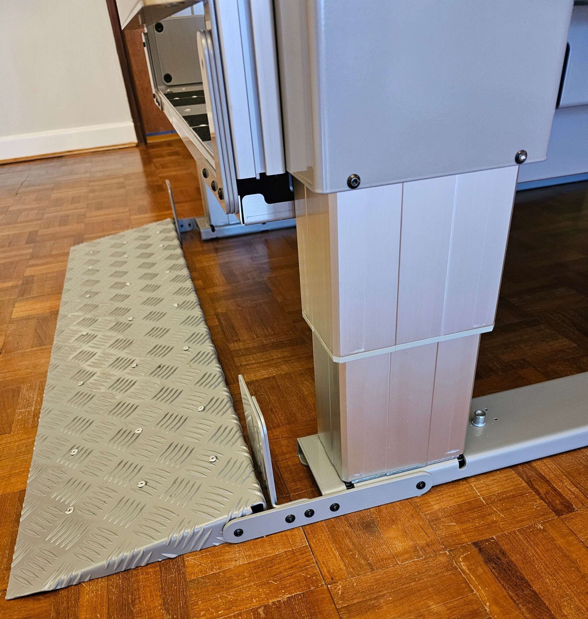 Silver ramped entrance to a platform lift