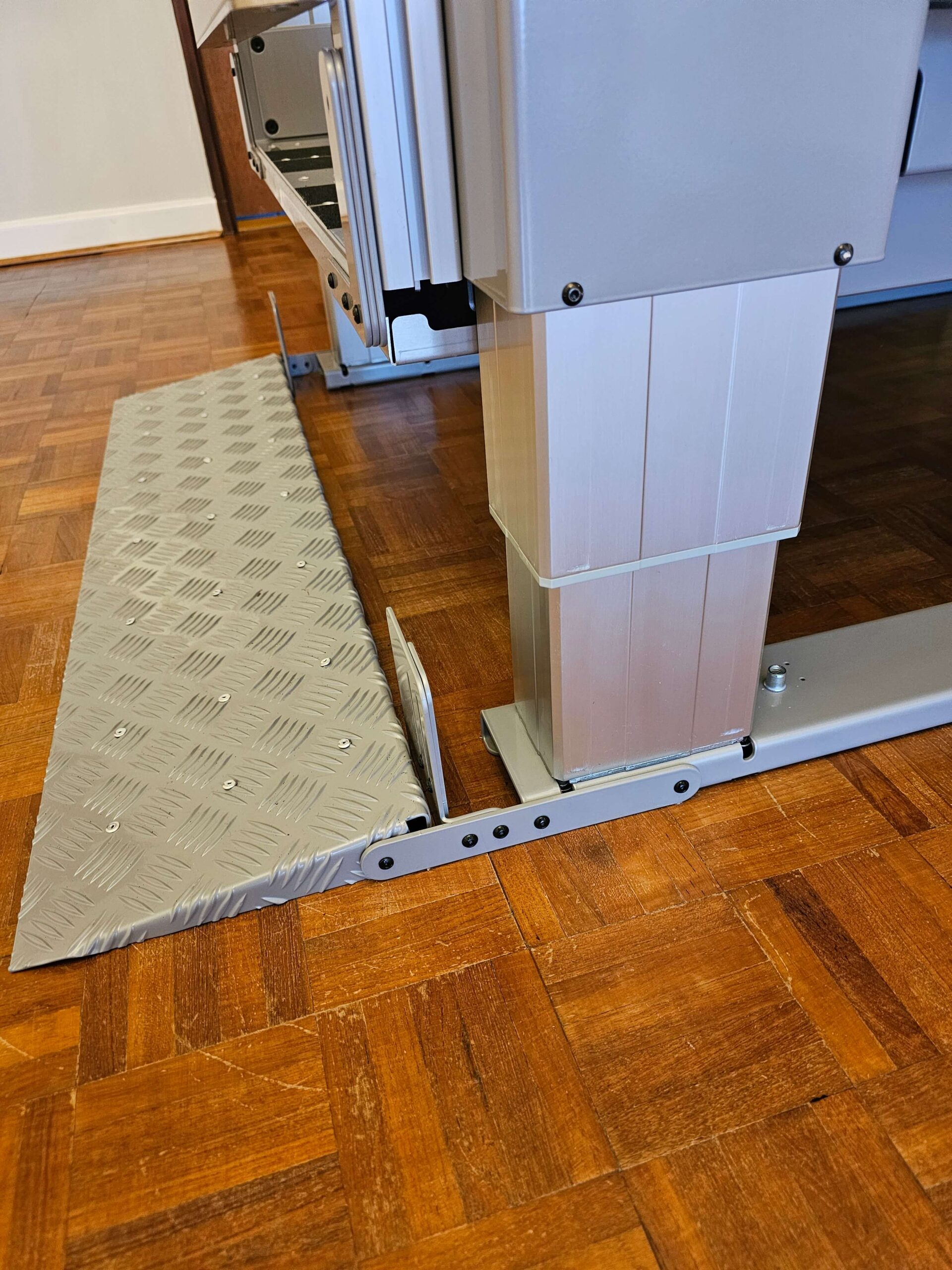 Silver ramped entrance to a platform lift