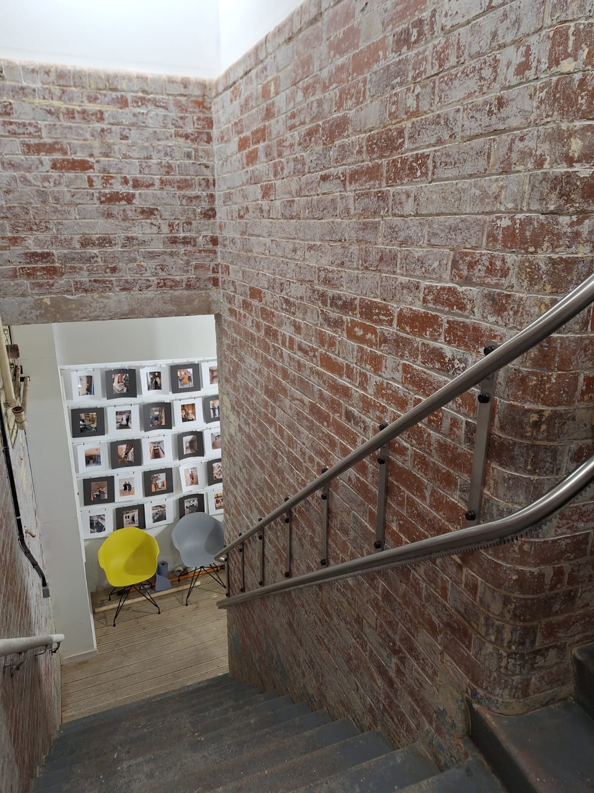 Rails fixed to a supporting wall for a platform stair lift