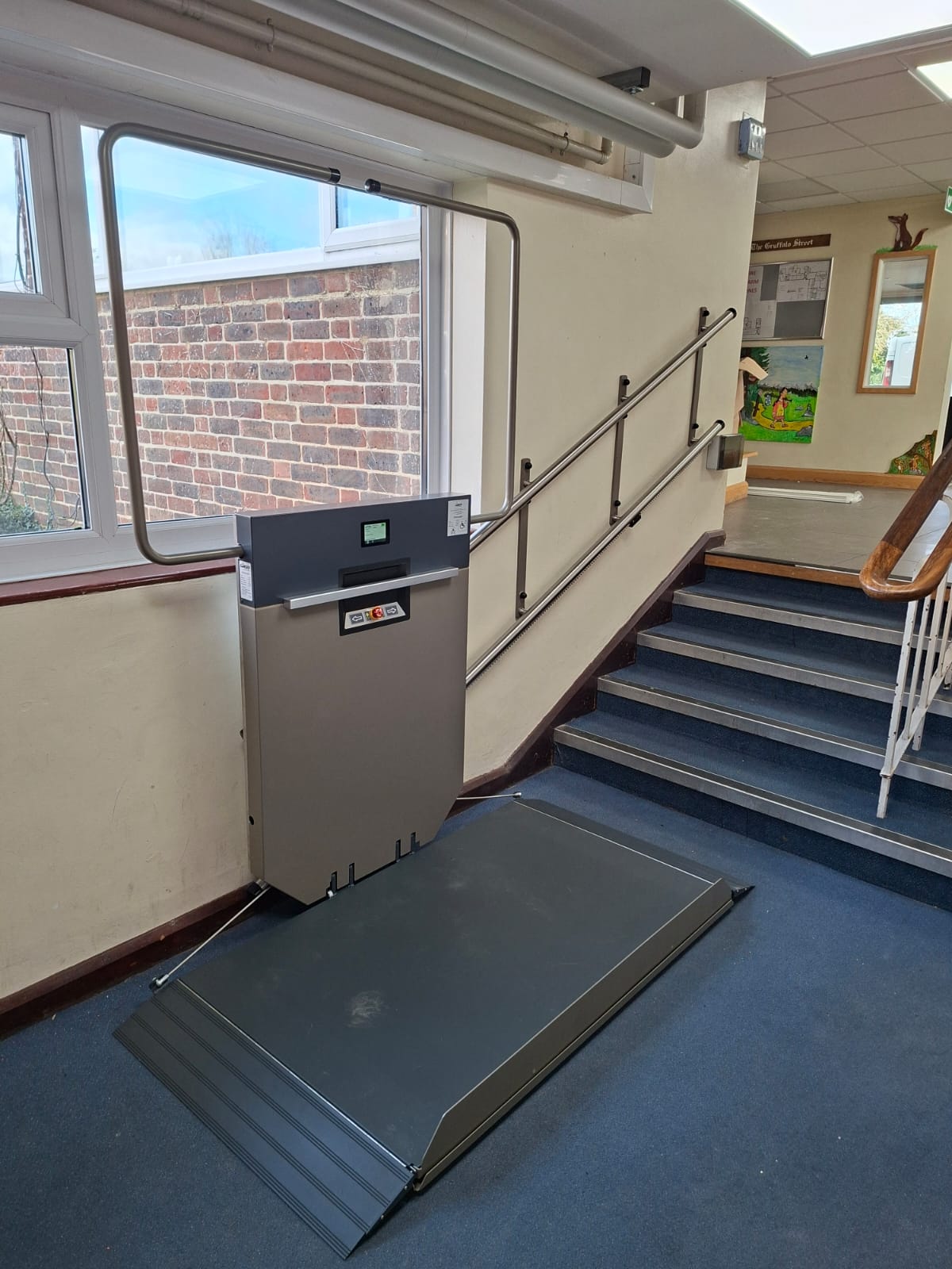 GTLE platform stair lift with platform extended, ready for wheelchair user at Laurel Lane Primary School