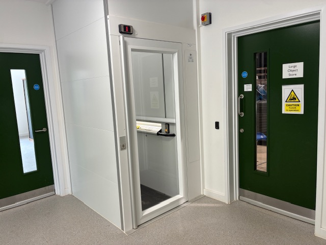 Vertical platform lift on the lower floor of the Food Museum next to the large object store room