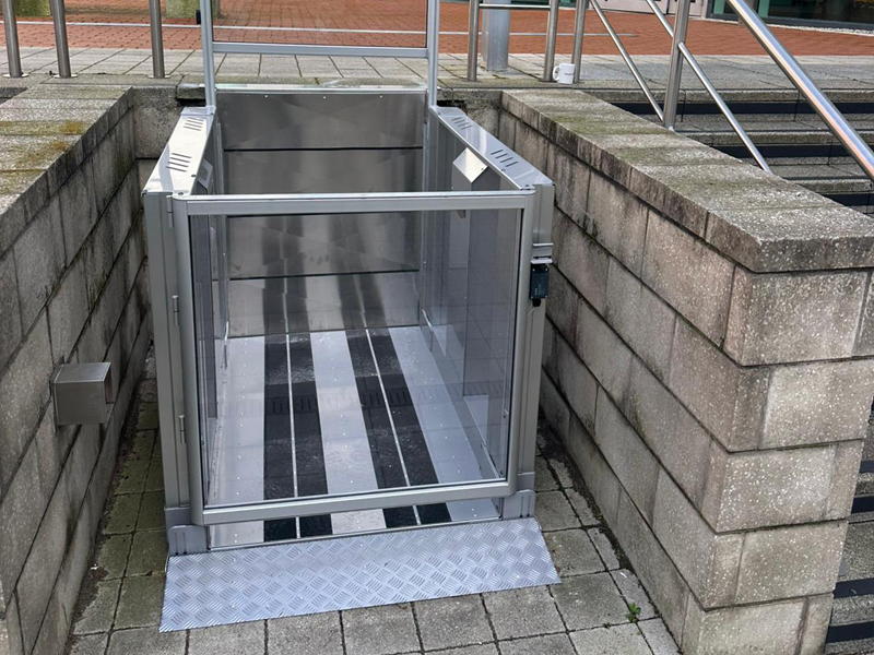 Tech Lift M4 external step lift at lower level at Colton Square, Leicester, showing the platform with anti-slip strips