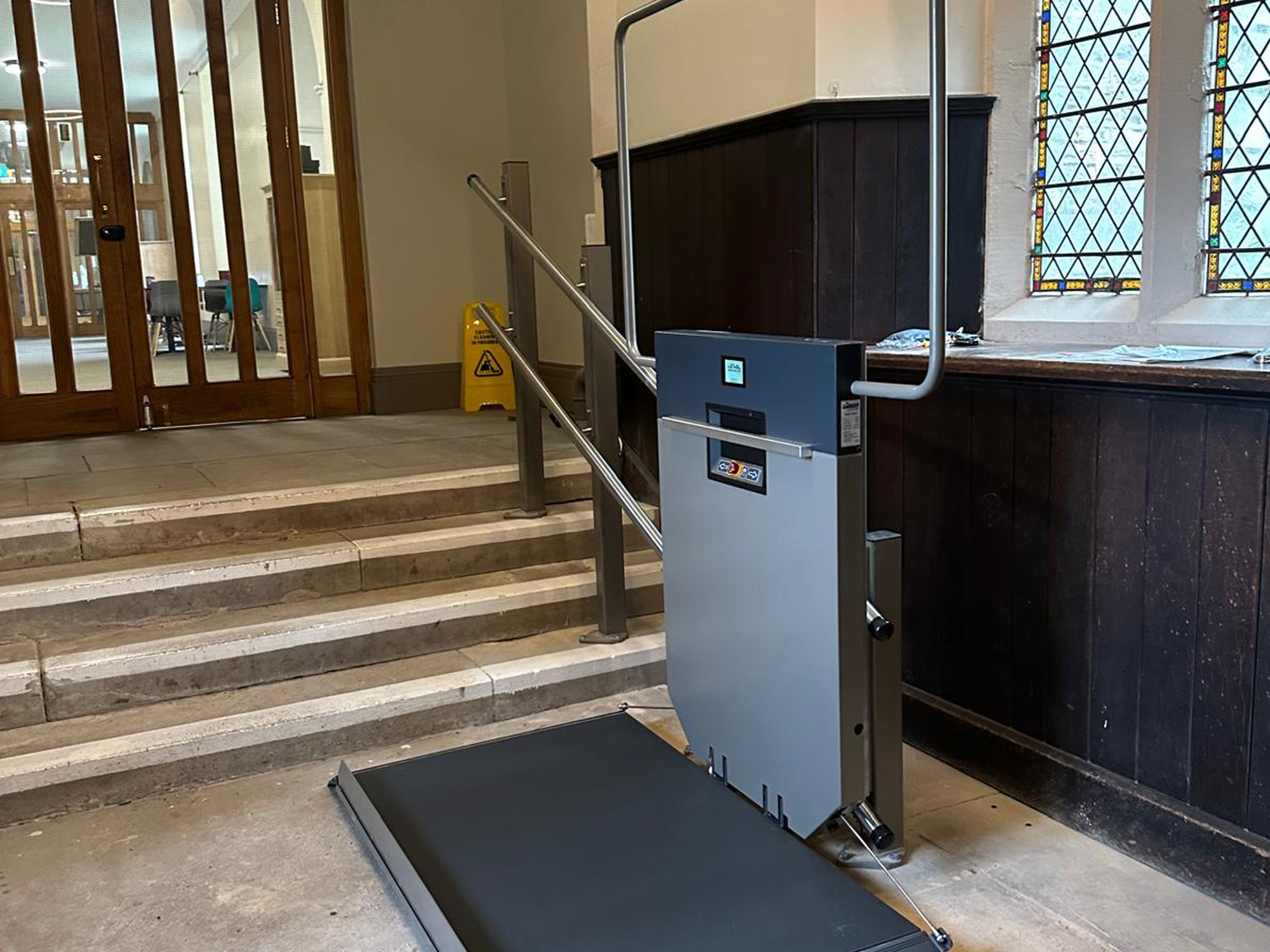 GTLE platform stair lift with platform deployed at lower landing, Ushaw Historic House chapel, County Durham