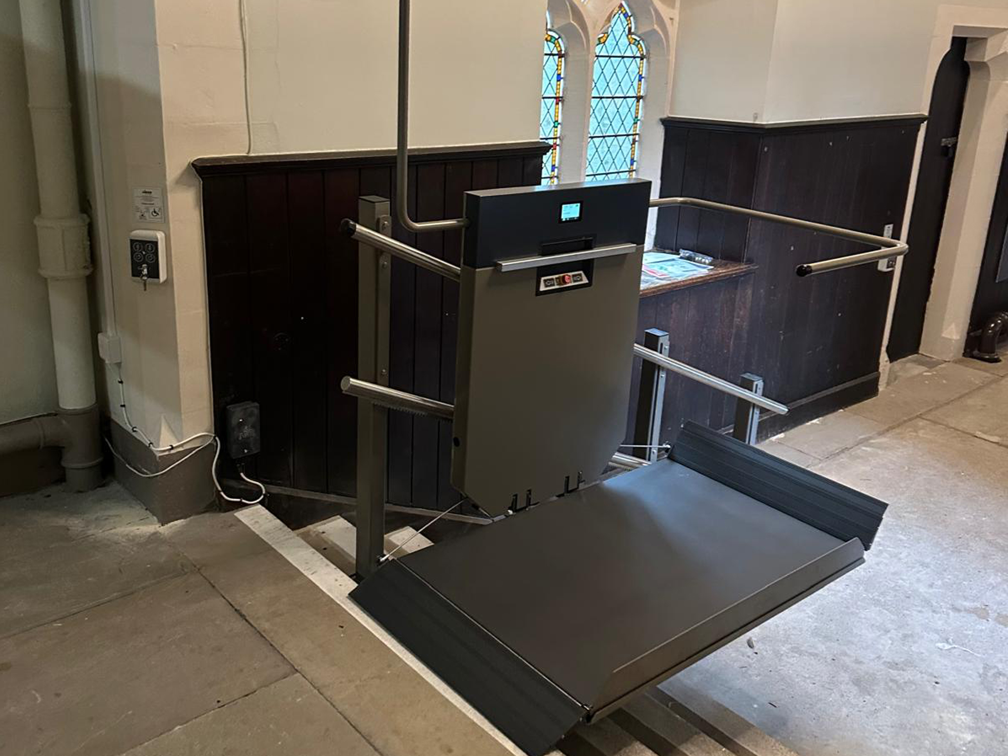 GTLE platform stair lift with deployed platform and guard rail at upper landing, Ushaw Historic House chapel
