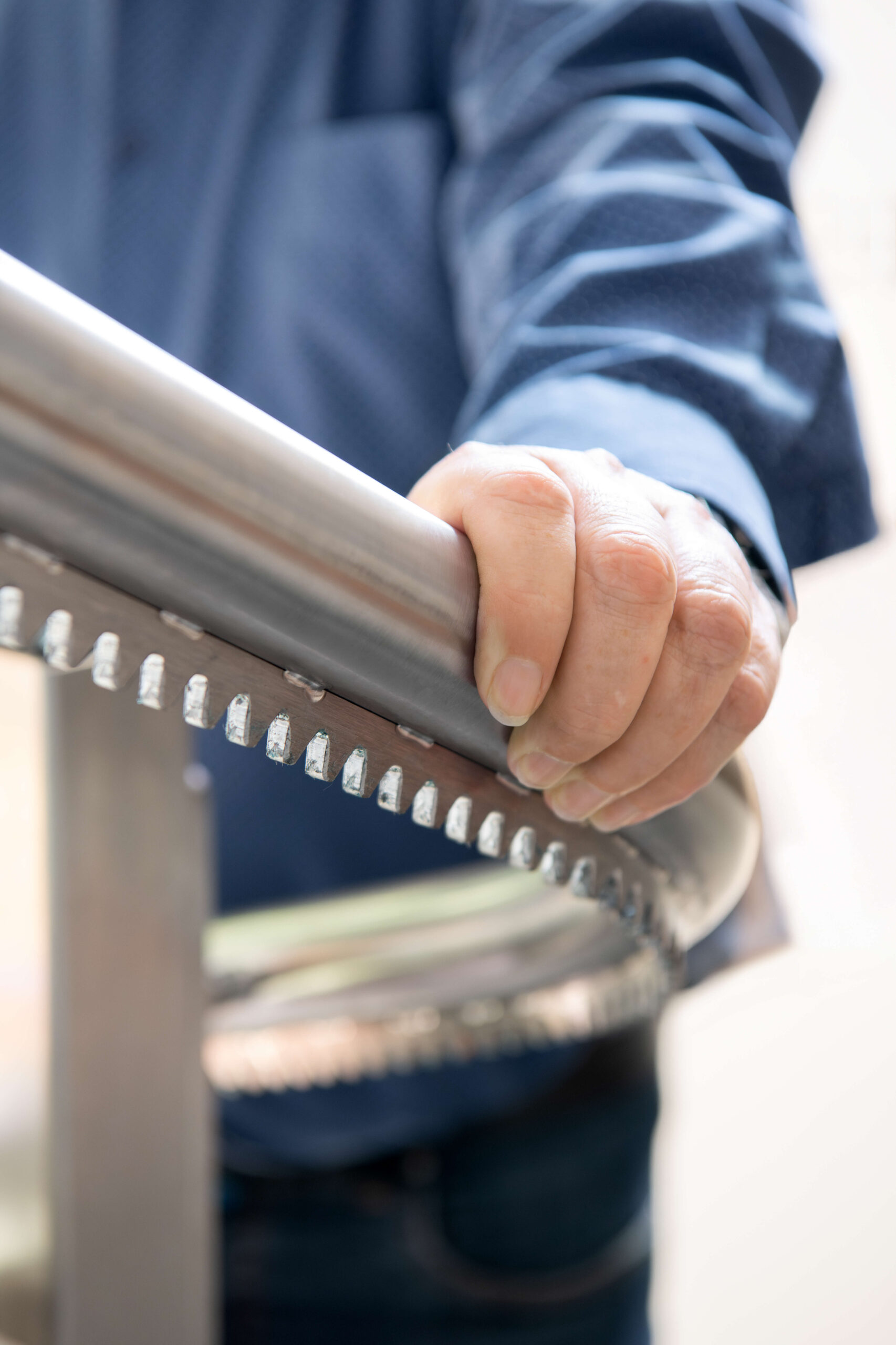Person holding onto a handrail