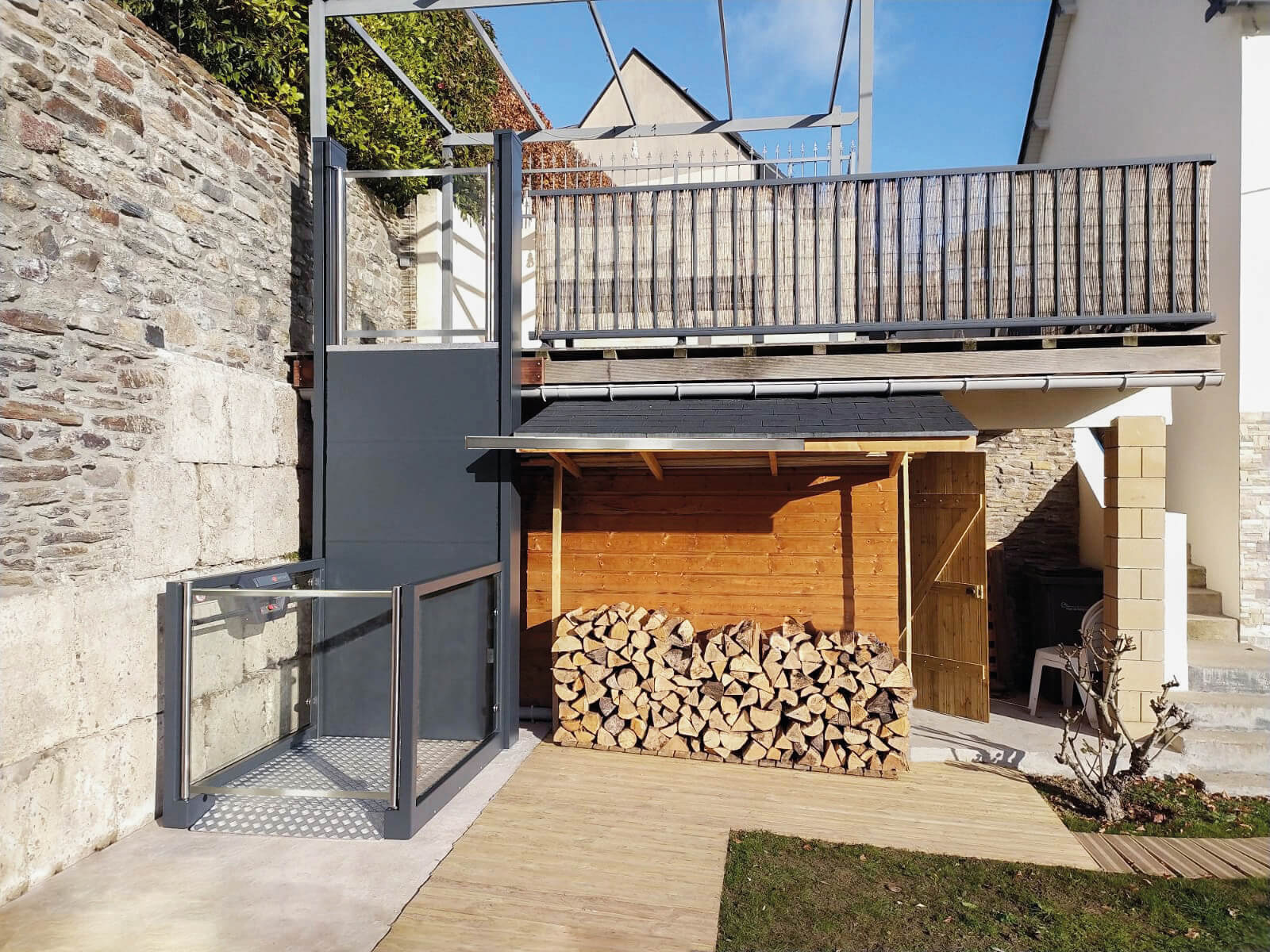 Open style platform lift in a courtyard.