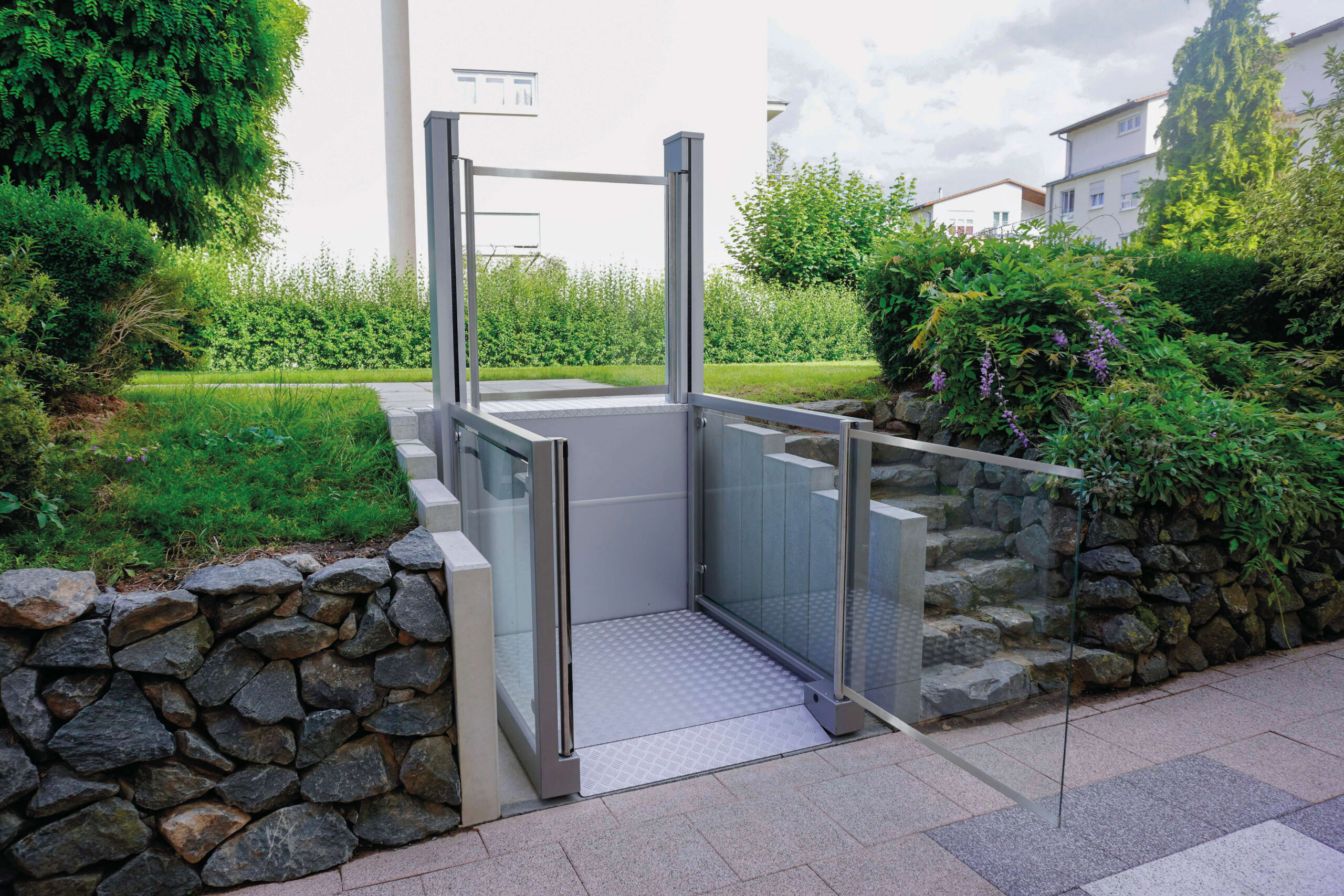Step lift installed within a garden setting