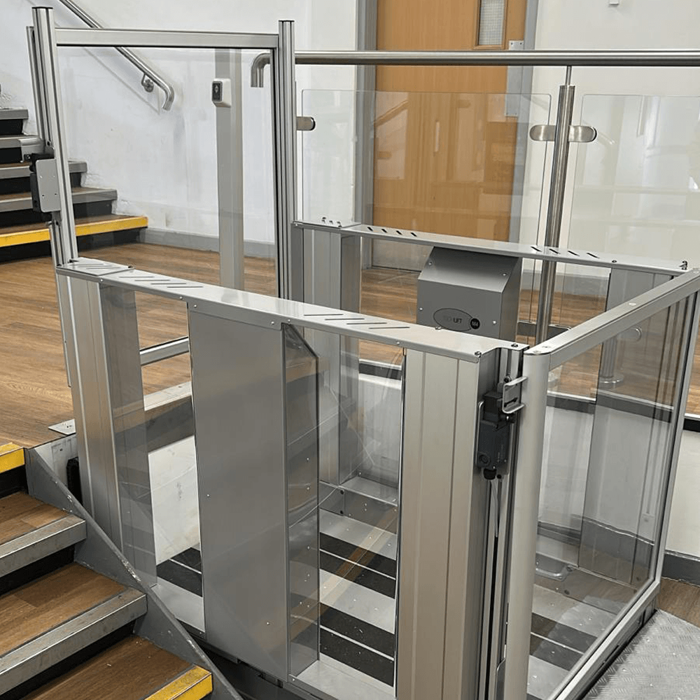 Tech Lift M4 Step lift installed within the existing footprint alongside the college staircase, with no structural changes to the stairs.